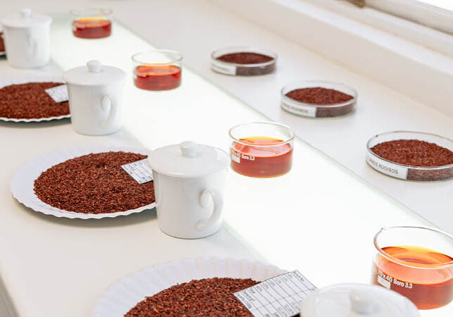 Various cuts of rooibos tea are laid out for grading