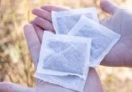 Carmien Pure Rooibos teabags held by two hands